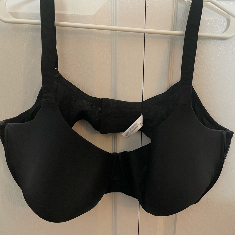 Black bra with blue lace in back. 48DDD